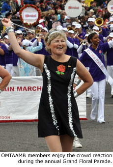 OMTAAMB members enjoy the crowd reaction during the annual Grand Floral Parade.