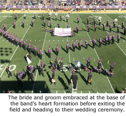 The bride and groom embraced at the base of the band's heart formation before exiting the field and heading to their wedding ceremony.