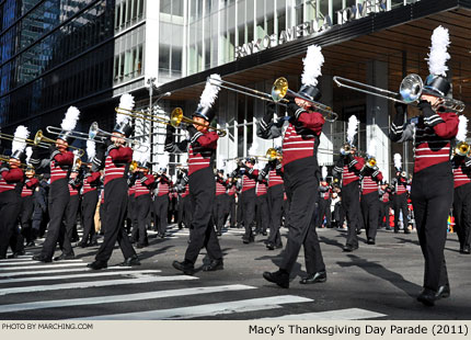 The band looks brilliant as it turns a corner and emerges from the shadows of tall buildings to step into full sun under a perfect blue sky. 2011 Macy's Thanksgiving Day Parade Photo by Marching.com