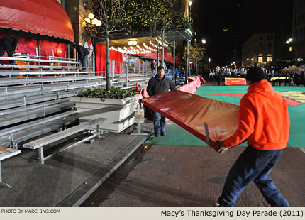 A crew completes the setup of bleacher seating. 2011 Macy's Thanksgiving Day Parade Photo by Marching.com