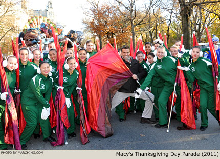 The Homestead H.S. (Cupertino, California) color guard took advantage of a photo op in the parade staging area along Central Park West. 2011 Macy's Thanksgiving Day Parade Photo by Marching.com