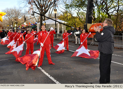 WGI operations director Bart Woodley leads Macy's Great American Marching Band color guard in warmup. 2011 Macy's Thanksgiving Day Parade Photo by Marching.com