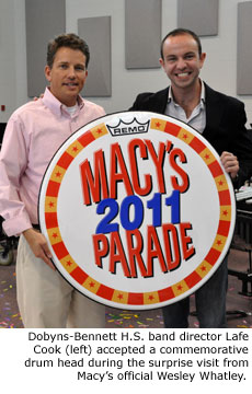 Dobyns-Bennett H.S. band director Lafe Cook accepted a commemorative drum head during the surprise visit from Macy's official Wesley Whatley.