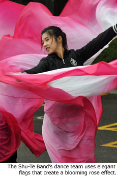 The Shu-Te Band's dance team uses elegant flags that create a blooming rose effect.