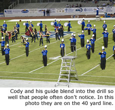 Cody and his guide blend into the drill so well that people often don't notice. In this photo they are on the 40 yard line.