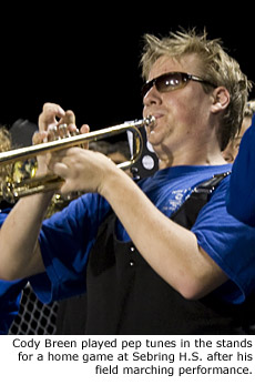 Cody Breen, center, played pep tunes from the stands after his field marching performance at a recent home game.