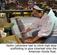 Kaitlin Lafreniere had to climb high atop scaffolding to glue silverleaf onto the American Honda float.